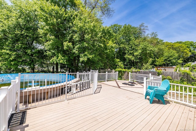 10 Cartier Rd, Enfield, CT 06082 - deck with view of wooded area and an outdoor pool
