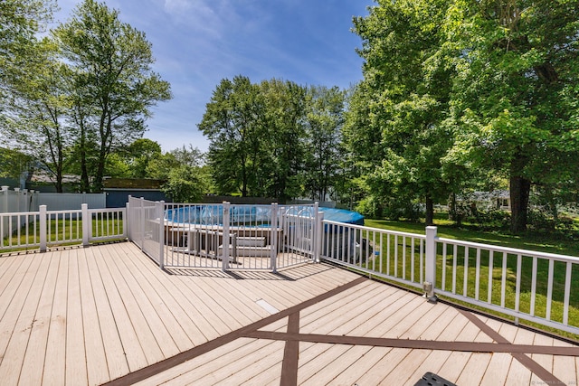 10 Cartier Rd, Enfield, CT 06082 - wooden deck featuring view of wooded area