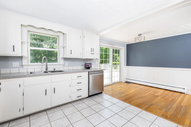 10 Cartier Rd, Enfield, CT 06082 - kitchen with stainless steel dishwasher, a baseboard radiator, a sink, light tile patterned floors, and white cabinetry
