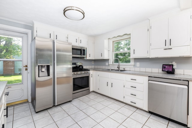 10 Cartier Rd, Enfield, CT 06082 - kitchen featuring appliances with stainless steel finishes, a sink, light countertops, white cabinets, and ornamental molding