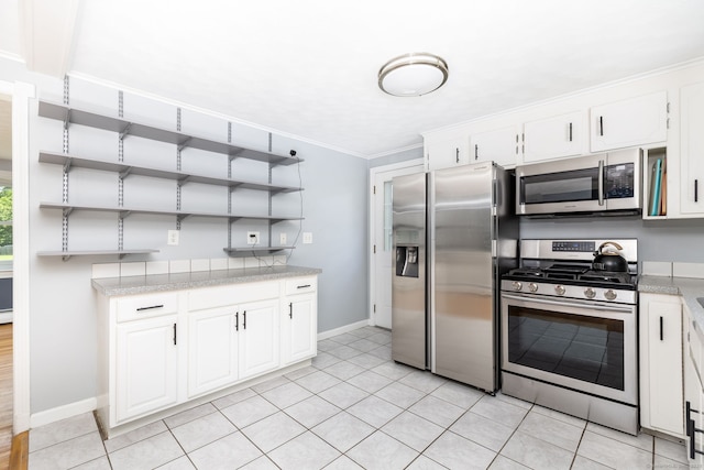 10 Cartier Rd, Enfield, CT 06082 - kitchen with stainless steel appliances, open shelves, baseboards, white cabinetry, and crown molding