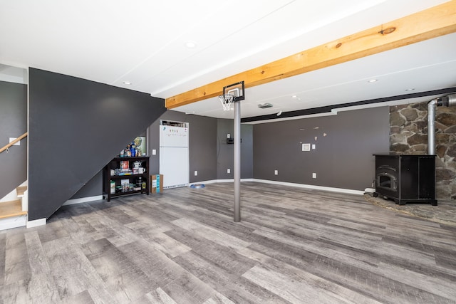 10 Cartier Rd, Enfield, CT 06082 - finished below grade area featuring wood finished floors, stairs, baseboards, and a wood stove