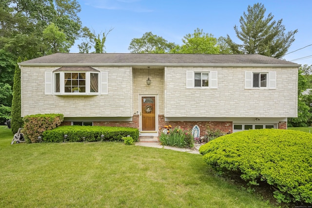 15 Amherst Pl, Stamford, CT 06902 - bi-level home featuring a front yard and stone siding