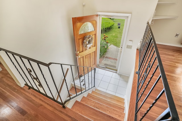 15 Amherst Pl, Stamford, CT 06902 - entryway featuring stairs, wood finished floors, and baseboards