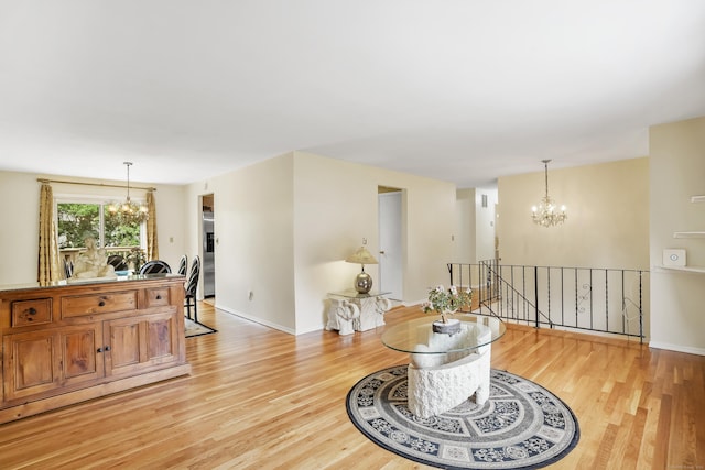 15 Amherst Pl, Stamford, CT 06902 - living room with a chandelier, light wood-style floors, and baseboards