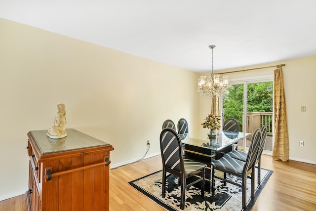 15 Amherst Pl, Stamford, CT 06902 - dining space featuring a chandelier, light wood-style flooring, and baseboards