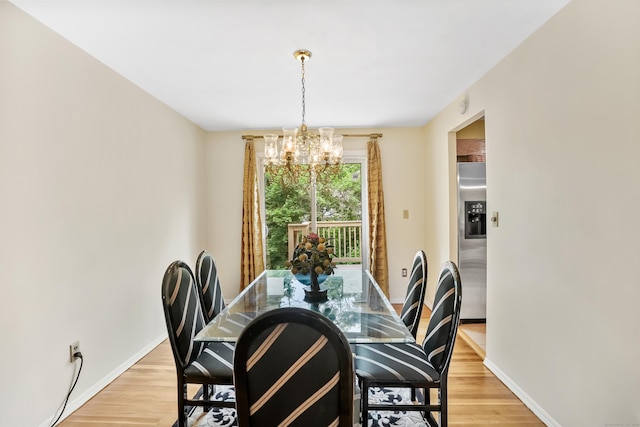 15 Amherst Pl, Stamford, CT 06902 - dining space featuring a chandelier, light wood-style floors, and baseboards