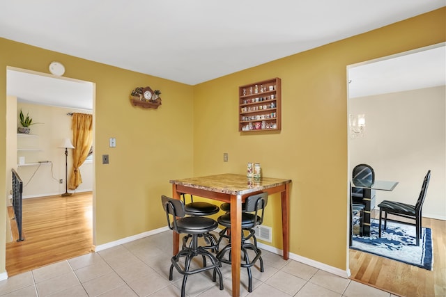 15 Amherst Pl, Stamford, CT 06902 - dining room with light tile patterned floors and baseboards