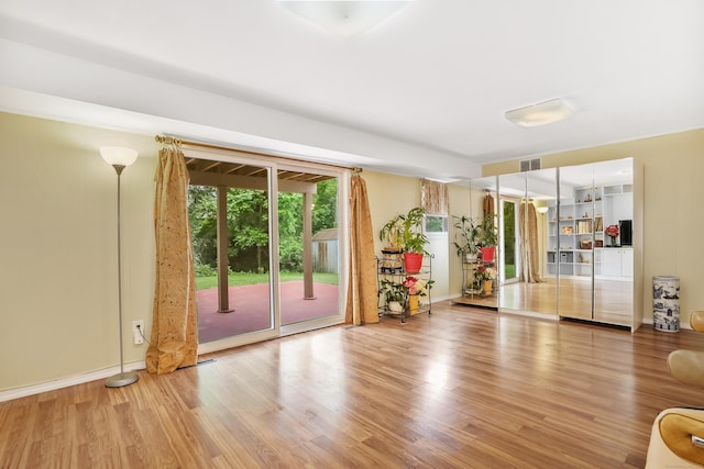 15 Amherst Pl, Stamford, CT 06902 - unfurnished living room featuring wood finished floors and baseboards