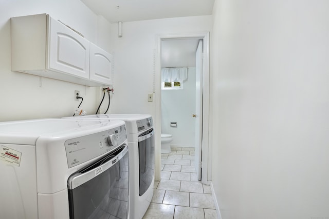 15 Amherst Pl, Stamford, CT 06902 - washroom featuring cabinet space, washing machine and clothes dryer, and light tile patterned floors