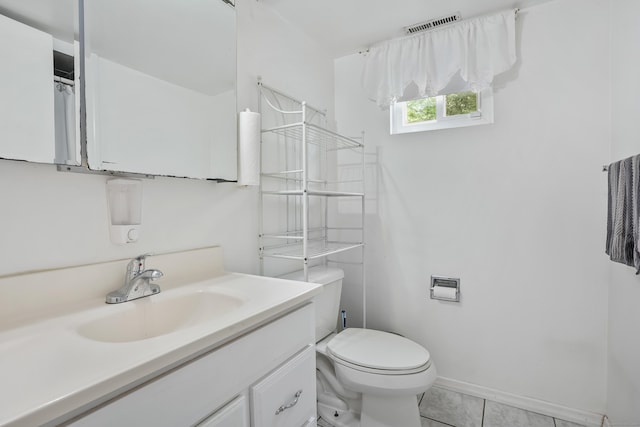 15 Amherst Pl, Stamford, CT 06902 - bathroom featuring toilet, vanity, tile patterned floors, and baseboards