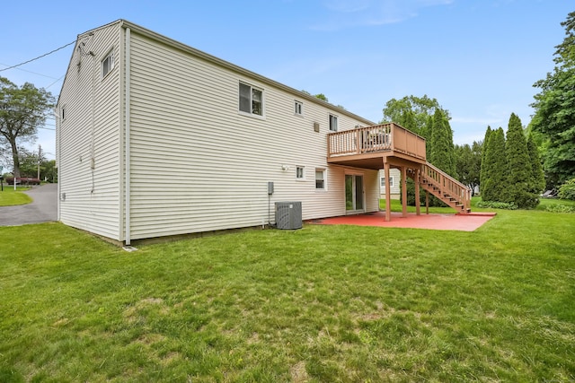15 Amherst Pl, Stamford, CT 06902 - rear view of house with a patio area, a wooden deck, a lawn, stairway, and central air condition unit