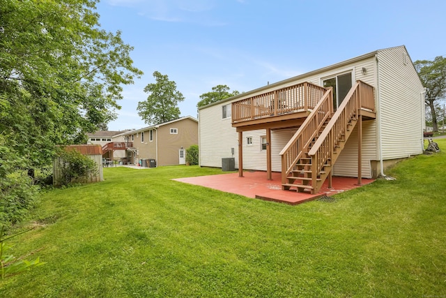 15 Amherst Pl, Stamford, CT 06902 - rear view of property with a wooden deck, a patio area, cooling unit, and a yard