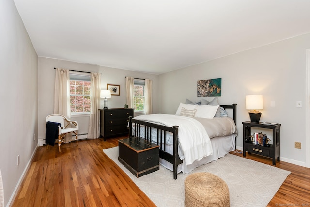 290 Fillow St, Norwalk, CT 06850 - bedroom featuring light wood finished floors, baseboards, and baseboard heating