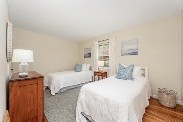 290 Fillow St, Norwalk, CT 06850 - bedroom with light wood-style flooring and baseboards