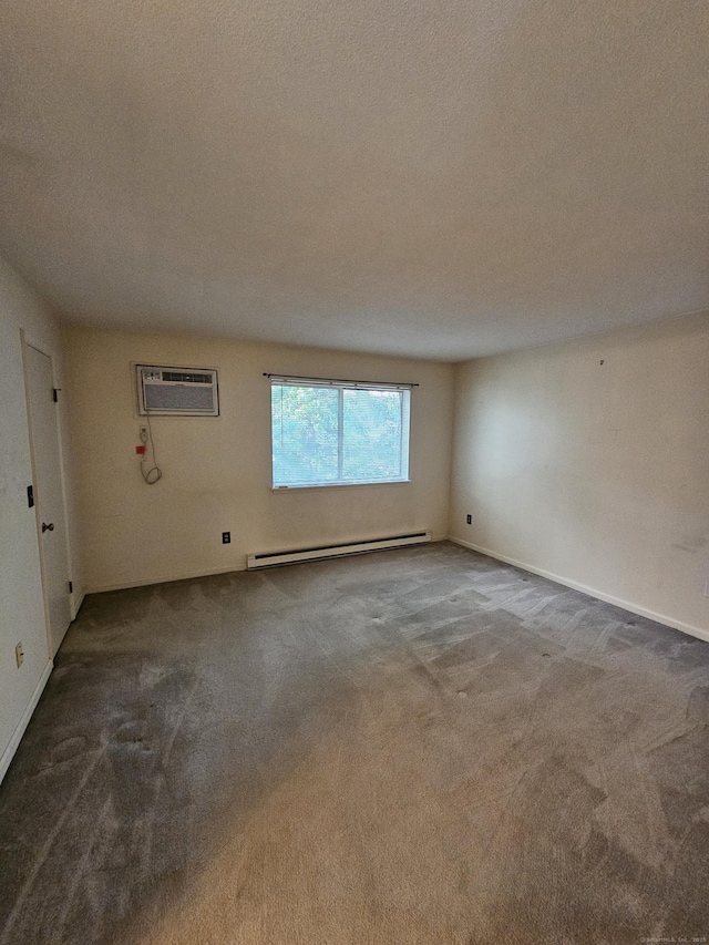 925 Oronoke Rd Unit 17F, Waterbury, CT 06708 - spare room with a baseboard heating unit, carpet floors, a wall mounted AC, and a textured ceiling
