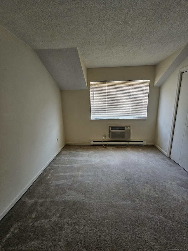 925 Oronoke Rd Unit 17F, Waterbury, CT 06708 - additional living space featuring carpet, a textured ceiling, an AC wall unit, and lofted ceiling