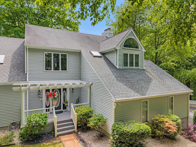 48 Shepherds Trl, Madison, CT 06443 - view of front facade featuring a shingled roof, a pergola, a deck, and a chimney