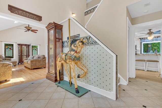 48 Shepherds Trl, Madison, CT 06443 - staircase with a ceiling fan, tile patterned floors, baseboards, and lofted ceiling