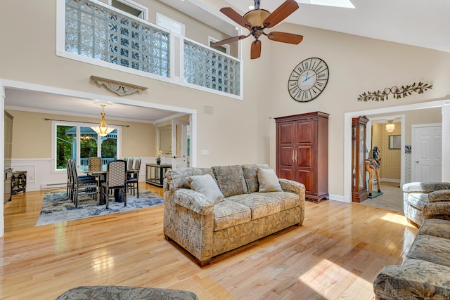 48 Shepherds Trl, Madison, CT 06443 - living area featuring a ceiling fan, light wood-style flooring, a towering ceiling, baseboard heating, and a chandelier