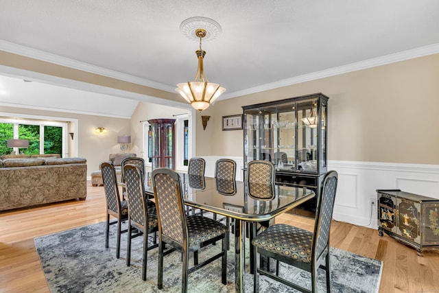 48 Shepherds Trl, Madison, CT 06443 - dining area with ornamental molding, light wood finished floors, wainscoting, and a chandelier