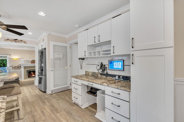 48 Shepherds Trl, Madison, CT 06443 - kitchen featuring stainless steel refrigerator, crown molding, ceiling fan, light wood-style flooring, and white cabinetry