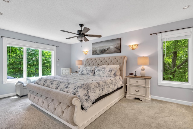 48 Shepherds Trl, Madison, CT 06443 - bedroom featuring multiple windows, light carpet, baseboards, and a textured ceiling