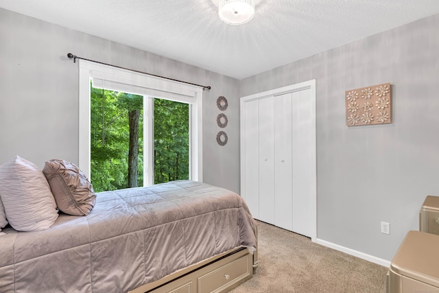 48 Shepherds Trl, Madison, CT 06443 - carpeted bedroom featuring a closet, baseboards, and a textured ceiling