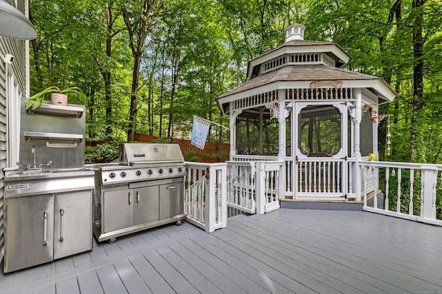 48 Shepherds Trl, Madison, CT 06443 - wooden deck featuring a gazebo, grilling area, a sink, and view of wooded area