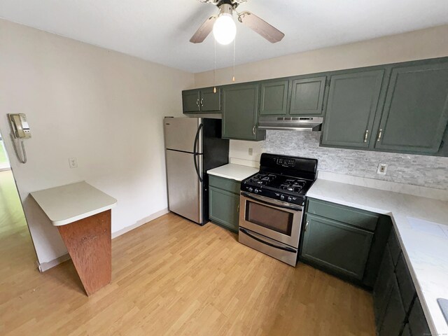 245 E Woodland St Apt 14, Meriden, CT 06451 - kitchen featuring appliances with stainless steel finishes, under cabinet range hood, decorative backsplash, and light countertops