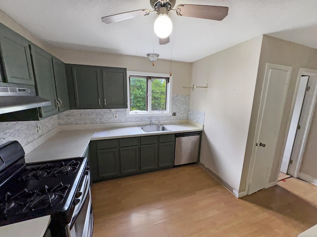 245 E Woodland St Apt 14, Meriden, CT 06451 - kitchen featuring range with gas stovetop, dishwasher, a sink, decorative backsplash, and light wood-style flooring