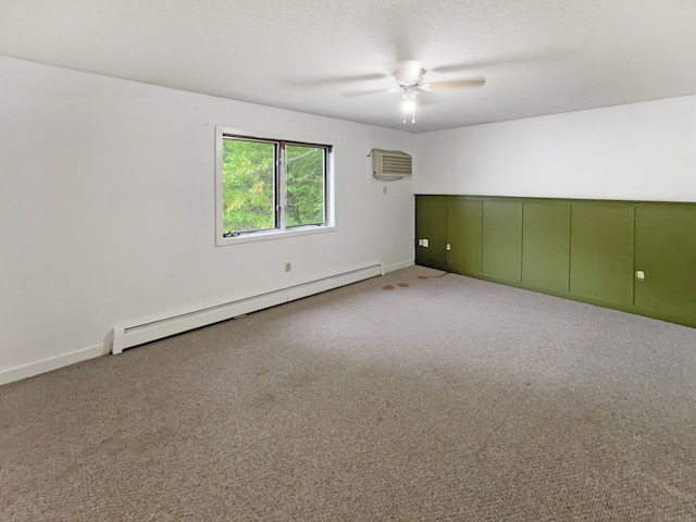 245 E Woodland St Apt 14, Meriden, CT 06451 - carpeted empty room with a baseboard radiator, an AC wall unit, ceiling fan, and baseboards