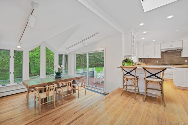 32 Jeffrey Rd, Greenwich, CT 06830 - dining room featuring light wood-style floors, rail lighting, lofted ceiling, and recessed lighting