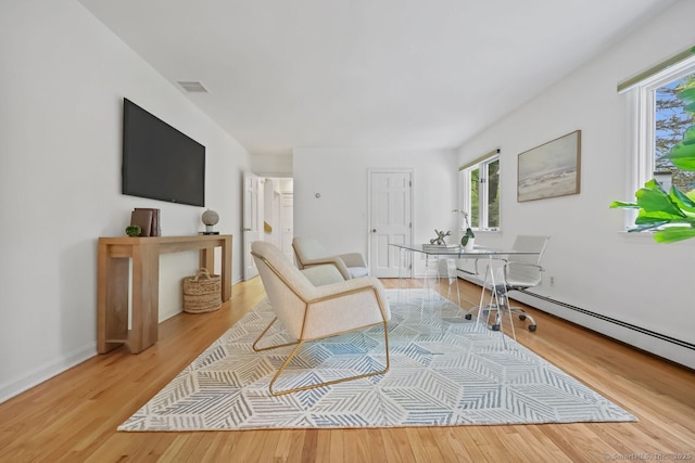 32 Jeffrey Rd, Greenwich, CT 06830 - living room featuring plenty of natural light, wood finished floors, and baseboards