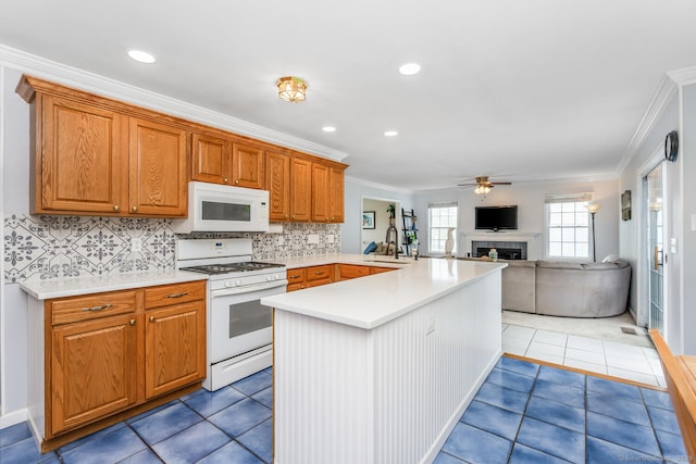125 Longview Dr, Stratford, CT 06614 - kitchen featuring white appliances, a fireplace, crown molding, a peninsula, and ceiling fan
