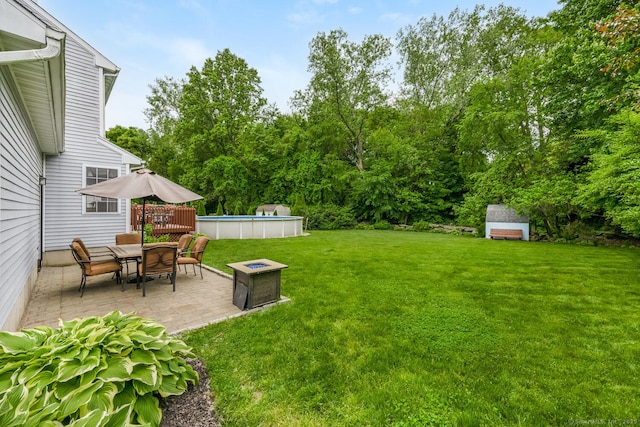 125 Longview Dr, Stratford, CT 06614 - view of green lawn featuring a patio area, an outdoor pool, and a deck