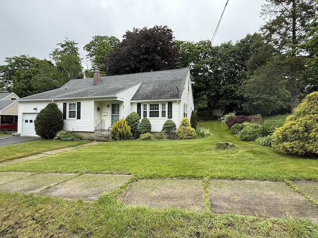 284 Gilbert Ave, Winchester, CT 06098 - view of front of home with a garage, a front yard, asphalt driveway, roof with shingles, and a chimney
