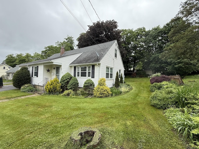 284 Gilbert Ave, Winchester, CT 06098 - view of front of home featuring a front lawn, a chimney, and roof with shingles