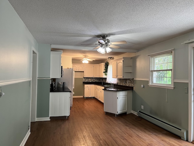 284 Gilbert Ave, Winchester, CT 06098 - kitchen featuring baseboard heating, dark countertops, ceiling fan, dark wood-style floors, and a textured ceiling