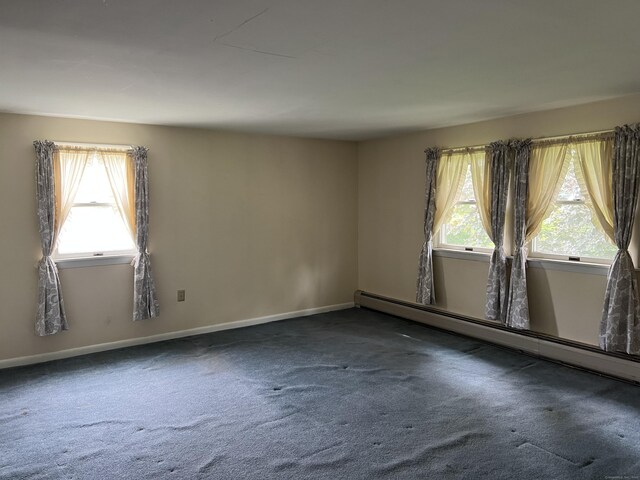 284 Gilbert Ave, Winchester, CT 06098 - carpeted empty room with plenty of natural light, a baseboard heating unit, and baseboards