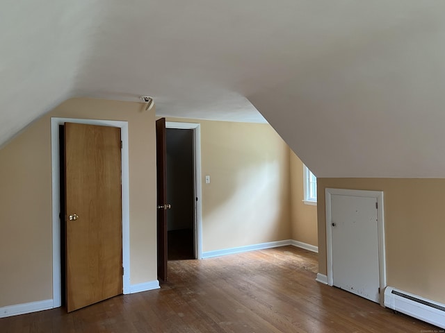 284 Gilbert Ave, Winchester, CT 06098 - additional living space with baseboard heating, lofted ceiling, wood finished floors, and baseboards