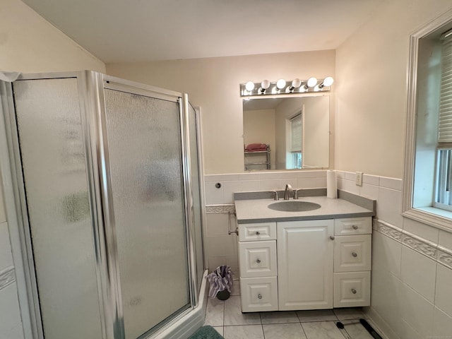 87 Munson Rd, Beacon Falls, CT 06403 - bathroom with tile walls, a shower stall, vanity, wainscoting, and tile patterned flooring