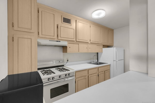 2625 Park Ave Unit 7R, Bridgeport, CT 06604 - kitchen with white appliances, range hood, light brown cabinets, and a sink