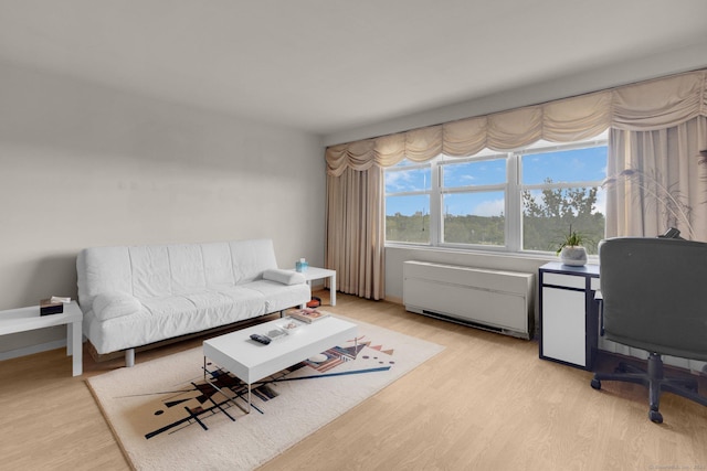 2625 Park Ave Unit 7R, Bridgeport, CT 06604 - living area with light wood-style floors, radiator, and an office area