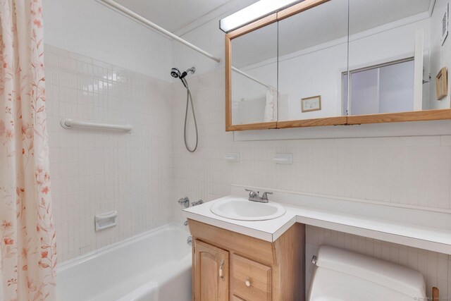 2625 Park Ave Unit 7R, Bridgeport, CT 06604 - bathroom featuring shower / tub combo with curtain, vanity, and decorative backsplash