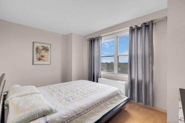 2625 Park Ave Unit 7R, Bridgeport, CT 06604 - bedroom featuring wood finished floors and radiator