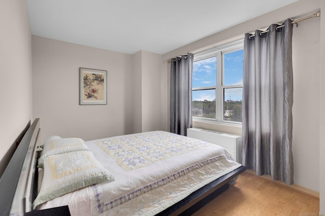 2625 Park Ave Unit 7R, Bridgeport, CT 06604 - bedroom featuring radiator and wood finished floors