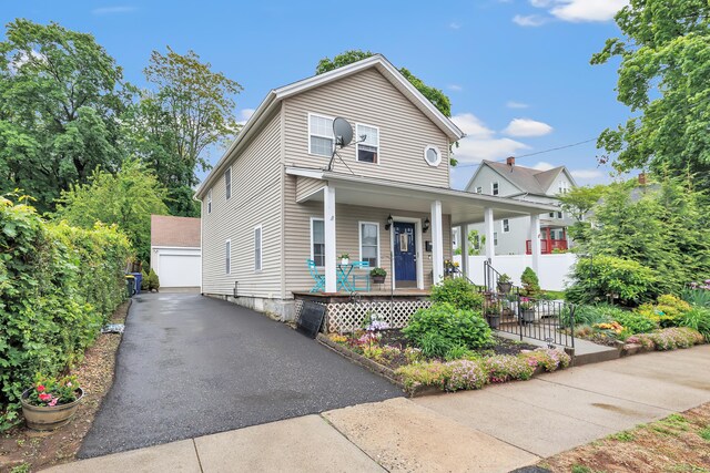 16 Hodge Ave, Ansonia, CT 06401 - view of front of home with an outdoor structure, a porch, and a detached garage