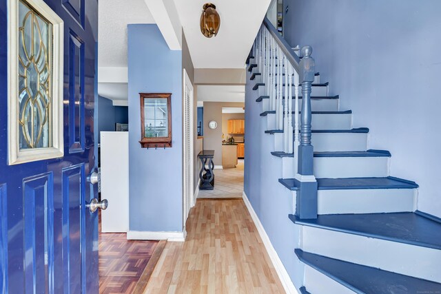 16 Hodge Ave, Ansonia, CT 06401 - entrance foyer featuring stairs, wood finished floors, and baseboards