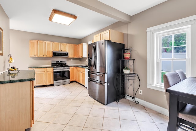 16 Hodge Ave, Ansonia, CT 06401 - kitchen featuring stainless steel appliances, light brown cabinetry, dark countertops, and light tile patterned flooring